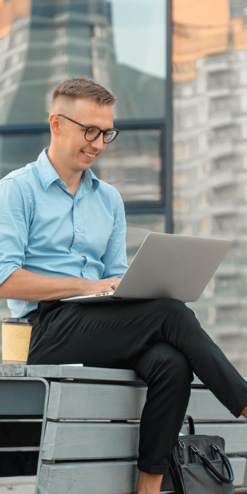 portrait-of-candid-millennial-young-happy-businessman-real-estate-agent-focused-on-reading-news-on_t20_9eJbGv